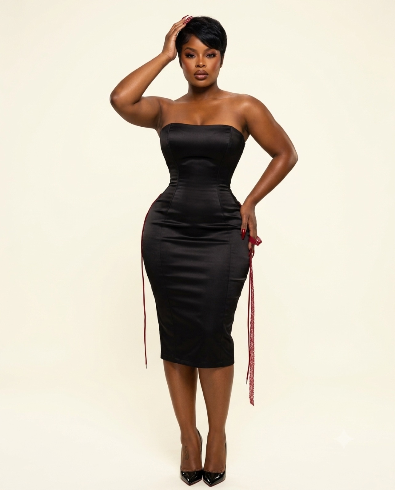 Kaneshia Williams, CEO and founder of BHOA United, wearing a black dress