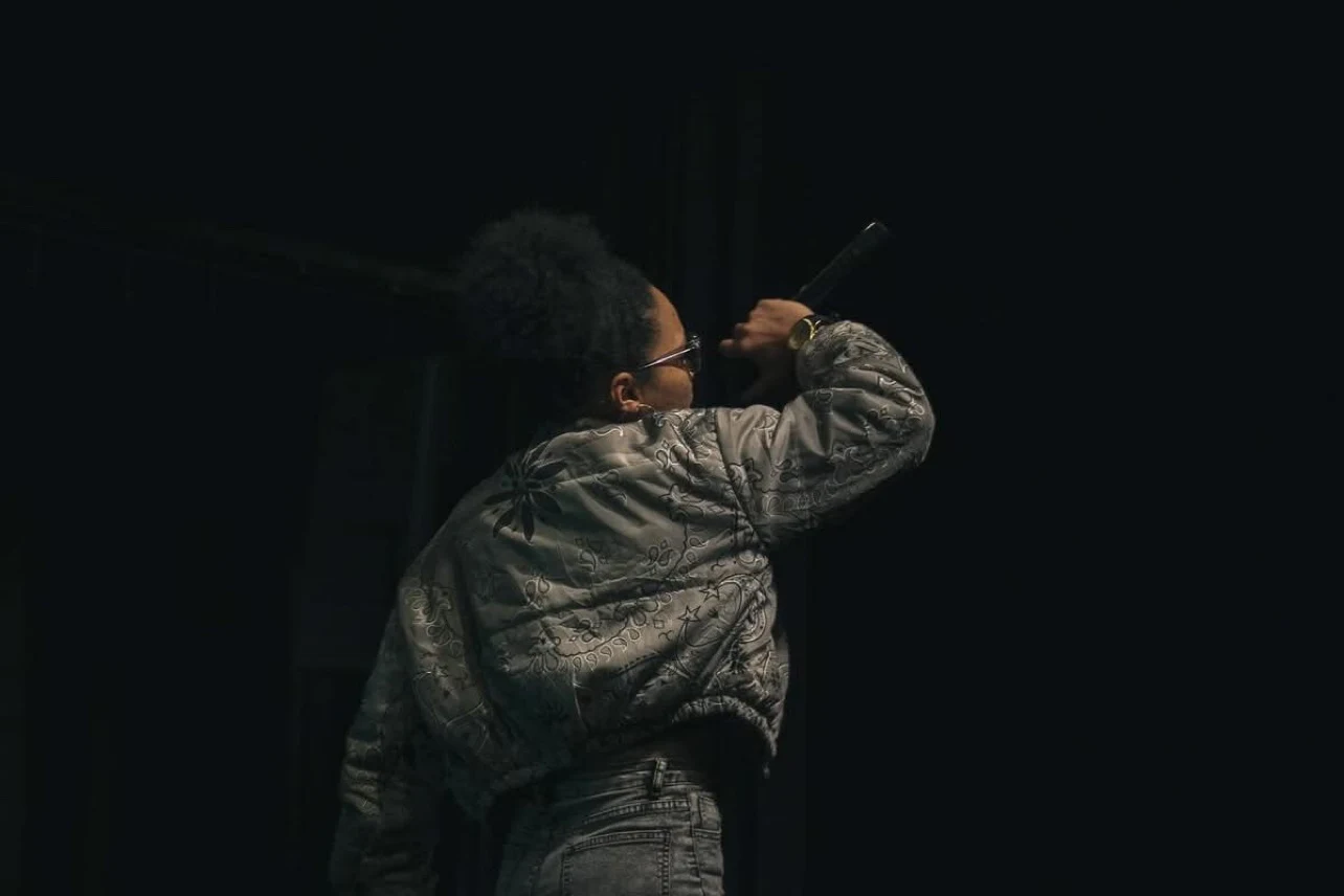 LeLe Montana performing on stage, viewed from behind