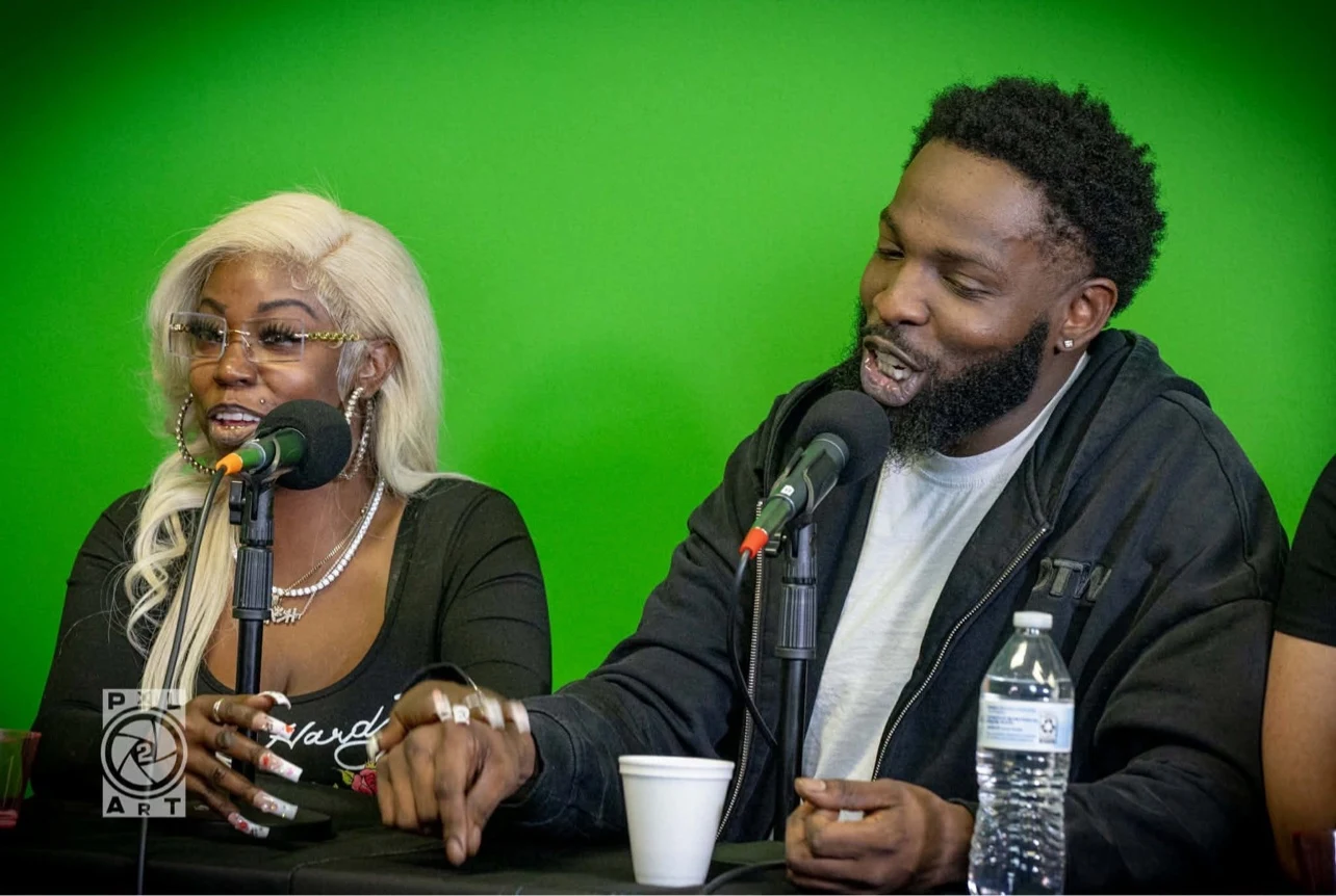 MillionDolla Ca$h speaking into a microphone during a studio interview
