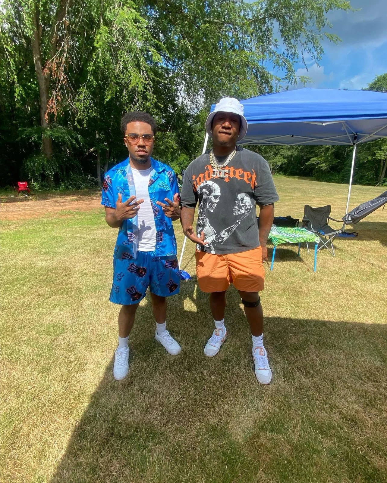 oNE Nuke at an outdoor event in a blue coordinated outfit