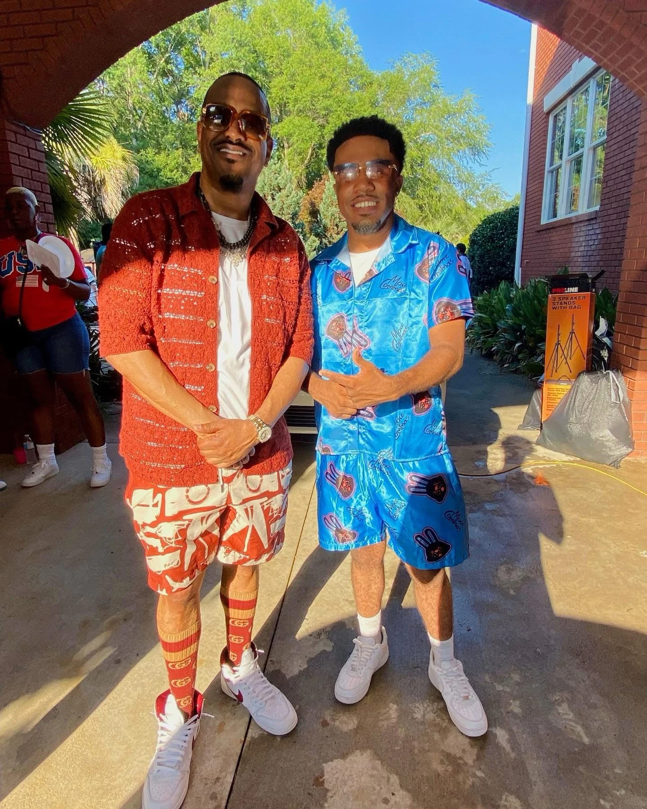 oNE Nuke posing with a fellow creative at an outdoor event