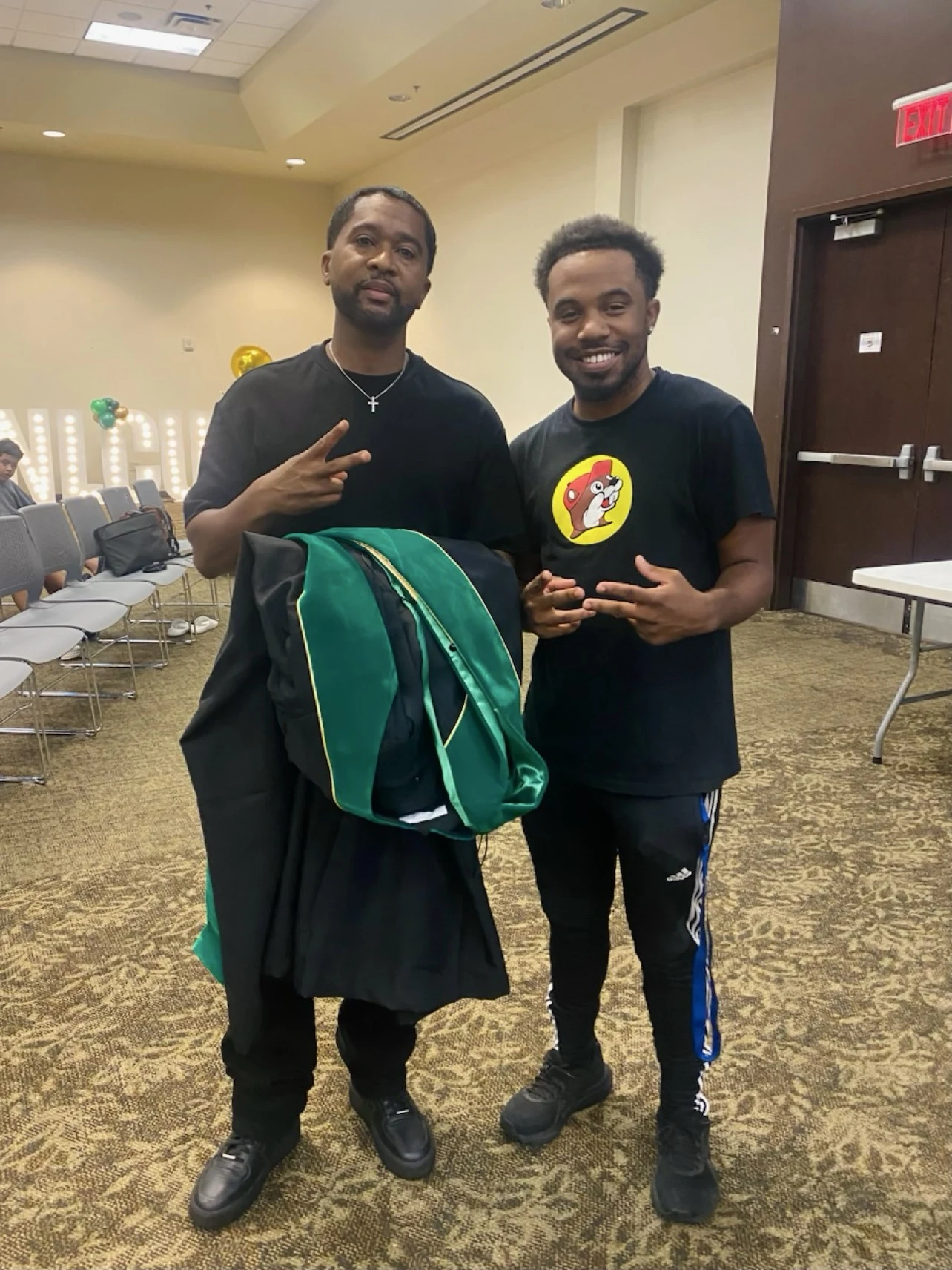 oNE Nuke with a fellow creative at an indoor event